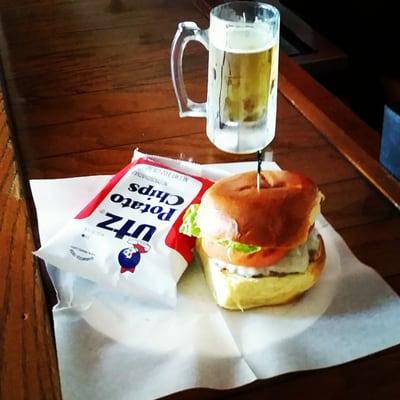 Cheeseburger with a mug of beer