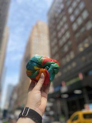 Specialty rainbow bagel with plain cream cheese!