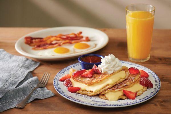 Stuffed Cheesecake Pancakes with strawberries and warm strawberry sauce to put on them!!