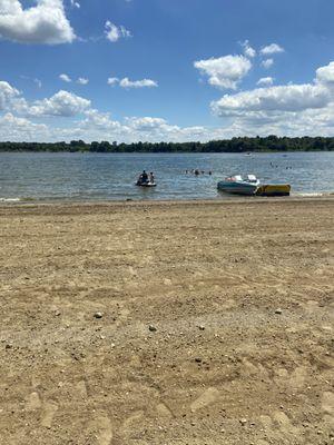 jet skis and boats that come into the same area that children are playing and swimming