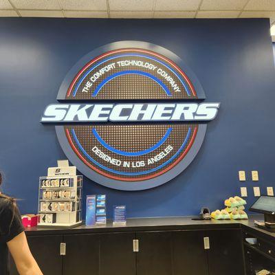 Skechers logo at front counter