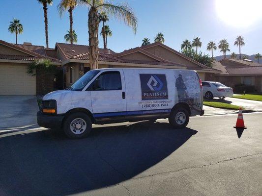 Company Van wrapped with white marble.