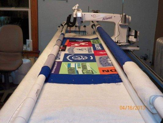 My long arm working on a quilt for graduate.