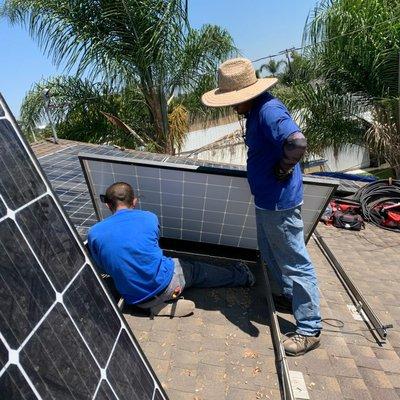 Solar panel re-install after roof repair.