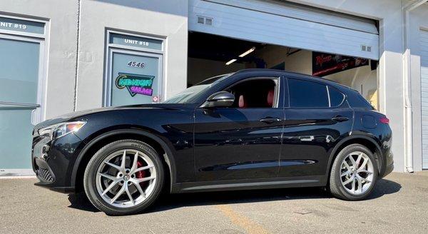 Alfa Romeo Stelvio with Madness Autoworks Sport springs installed from Midnight Garage.