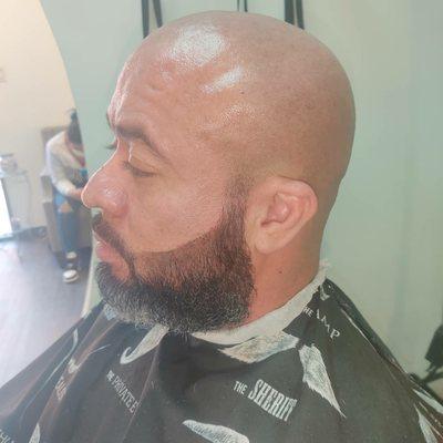 Clean shaven head, and beard trim and line up.