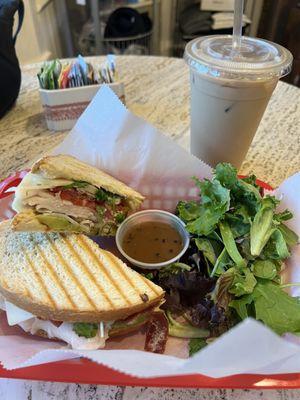 Avocado Hummus Turkey Club with green salad Vanilla iced latte