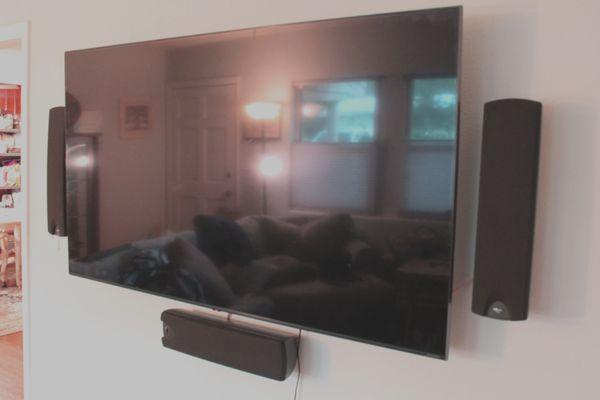 The end result of a TV and speaker mounting.