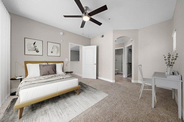 The Met furnished bedroom model unit, with ceiling fan, carpet floors