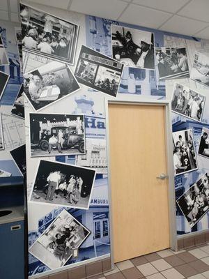 Wall with people enjoying their White Castle burgers.