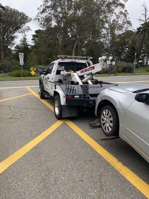 Seconds after this psychotic towing truck driver almost hit us. It's a one man operation, avoid at all costs.