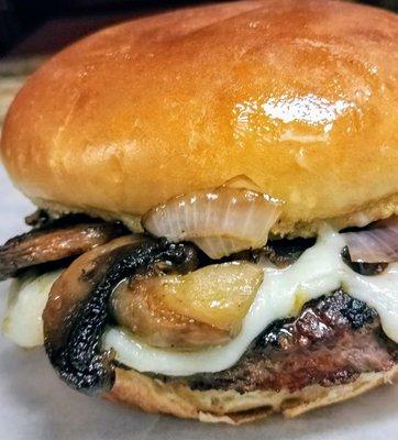 House Burger Fresh half pound burger with grilled mushroom and onion with swiss cheese on a toasted brioche bun