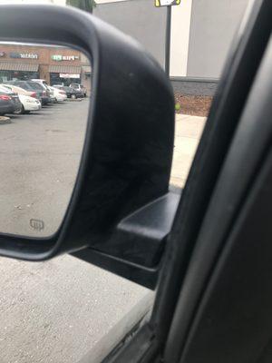 Dirty plastic between mirror and car