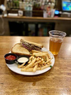 Corned beef sandwich with fries and a blond Guinness.