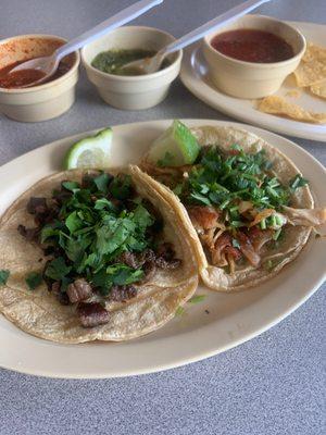 One beef and one chicken taco with the best... Truly hot sauce I have had in a long time, so smooth and such a kick!!!