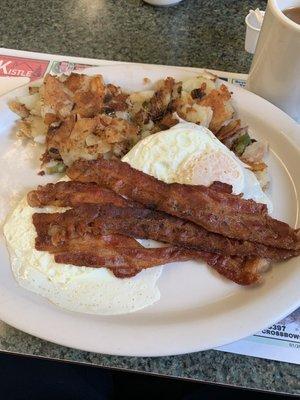 Two eggs, bacon and home fries.