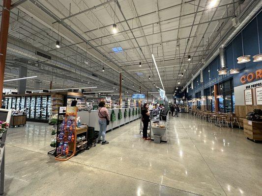 Plenty of self checkout stations and sitting areas for food and drinks