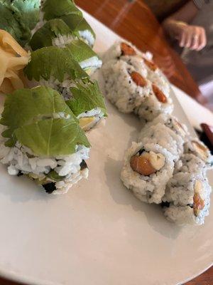 Rainforest roll (left), Japanese bagel roll(right), spicy tuna roll (back)