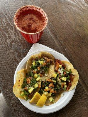 Tacos de asada & al pastor w/ pineapple followed by cilantro, cebolla, green & orange salsa