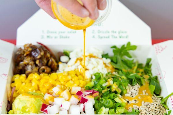 Our House Sweet Heat Dressing goes perfect with our signature Date Delight Salad!