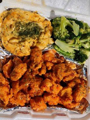 Bang bang chicken with Mac and cheese with a side of steamed broccoli.