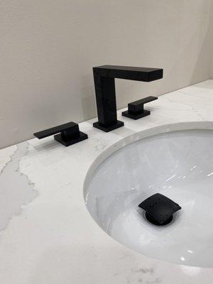 Custom vanity installation with faucet and clicker drain.