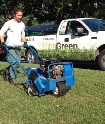 Caleb Aerating a Lawn