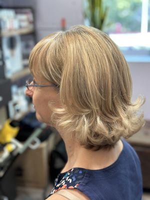 A fun haircut and style with flipped ends.  A cute fun style!