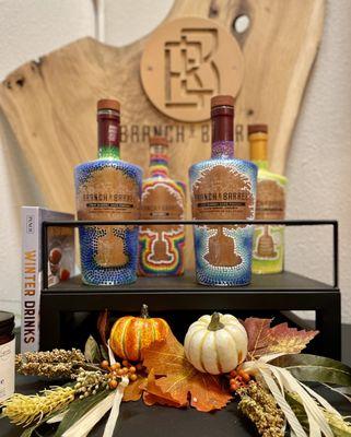 Display of beautiful bottles and fall decorations