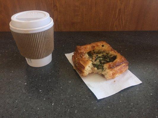 Cup of coffee and little pastry thing.