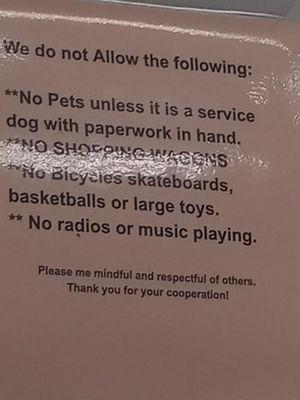 This is the sign they had posted were they are demanding proof that your animal is a service animal which is against ADA laws of New York.