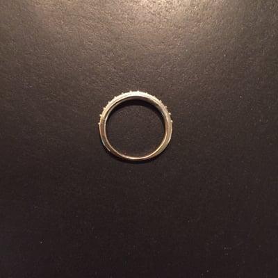 My wedding band re-sized horribly. Notice the odd shape and how thin the metal is on the bottom.