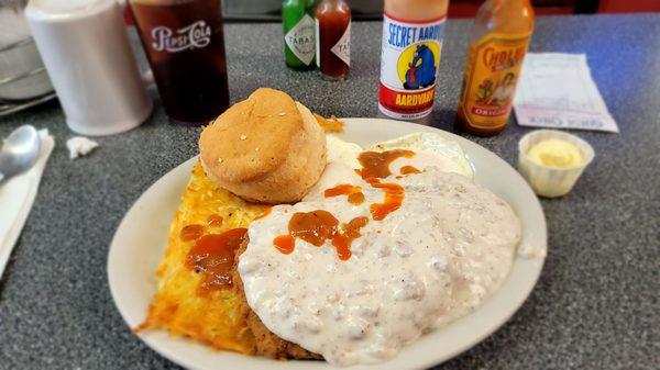 Delicious chicken fried steak breakfast. $13.99 and a big portion! (I smothered it with habanero hotsauce)