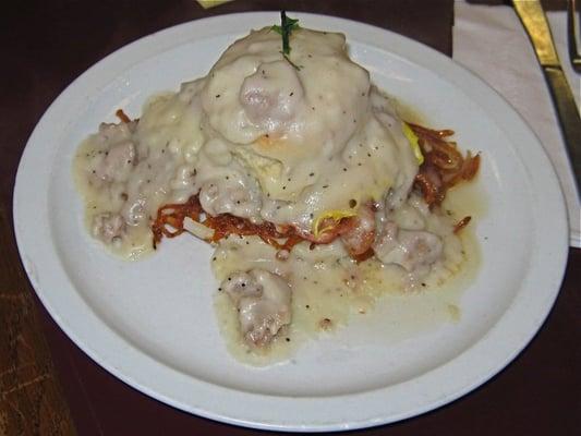 The Volcano, hash browns, biscuit, fried egg, breakfast meat of choice and biscuit all covered in sausage gravy