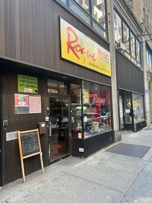 He's within the inside of this Music Store in a small workspace in the back.