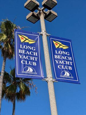 Long Beach Yacht Club banners on a streetlight