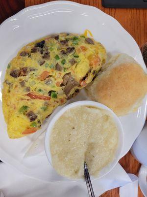 Western omlette with grits and a biscuit.