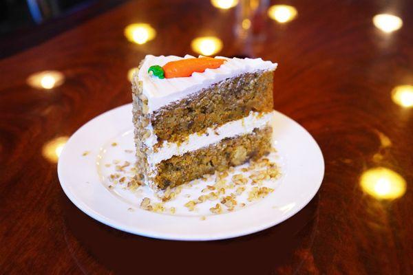 Moist, spiced, and loaded with fresh carrots and walnuts, topped with creamy frosting.