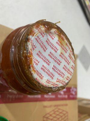 This is what I found when I opened a new jar of Huy Fong Chili Garlic Sauce from Global. Could be botulism.