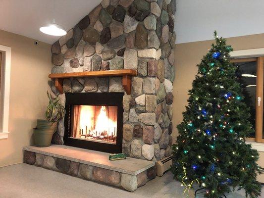 Fireplace and festive decorations in common area at Vacamas.