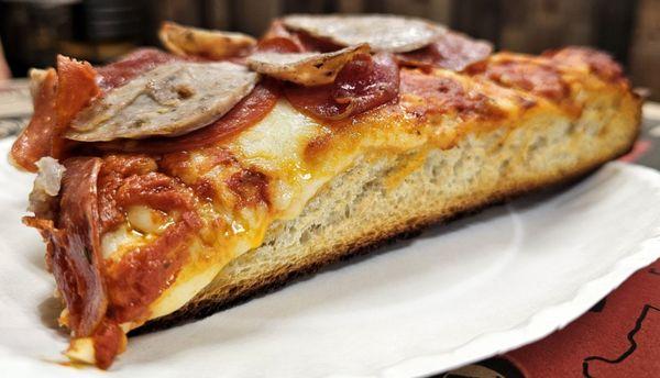 Sicilian slice with sausage and pepperoni