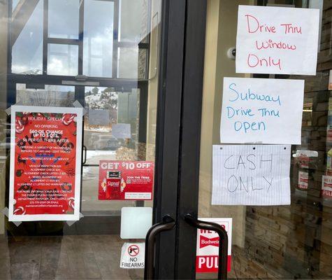 Door signage. Convenience store closed in Jan. 2023; only Subway drive-thru open.