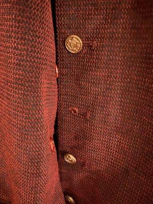 Missing button on vest