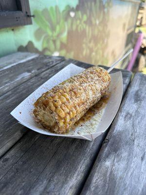 Delicious $8.00 smothered sweetcorn on the cob.