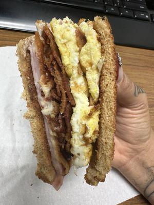 bacon, egg, ham and cheese sandwich.