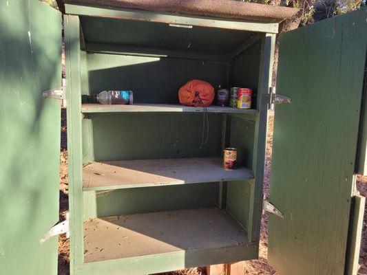 There's a cabinet you can donate food cans to.