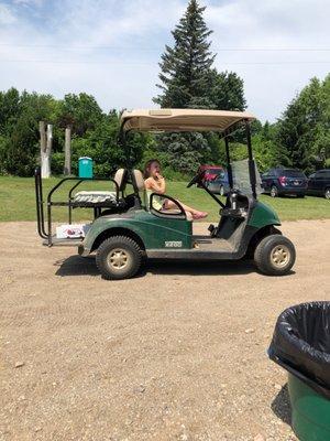 Getting ready to ride the golf cart.