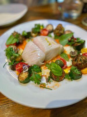 Eureka Black Cod - roasted under salt & herb crust, squash, frittella di zucchine, cherry tomato, capers, castelvetrano olives, passato