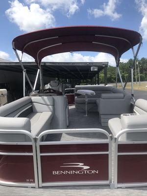 Inside look of new 20 foot Bennington pontoon boat with 50 hp four stroke motor