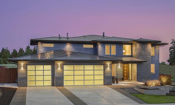 Northwest modern/contemporary glass garage door. Full view glass garage door. Anodized aluminum frames and white laminated glass.